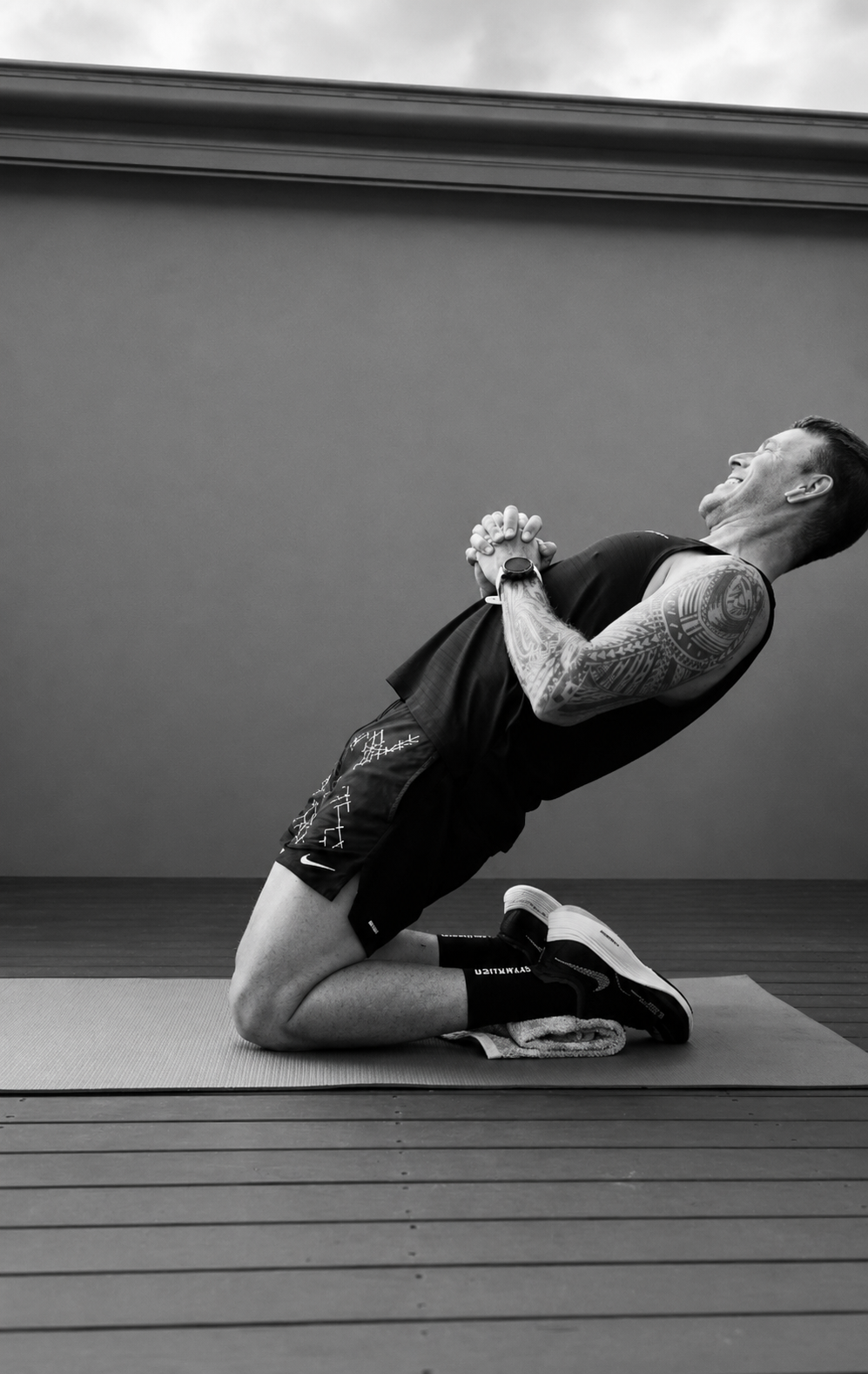 Phillipe performing a Nordic curl on a training mat