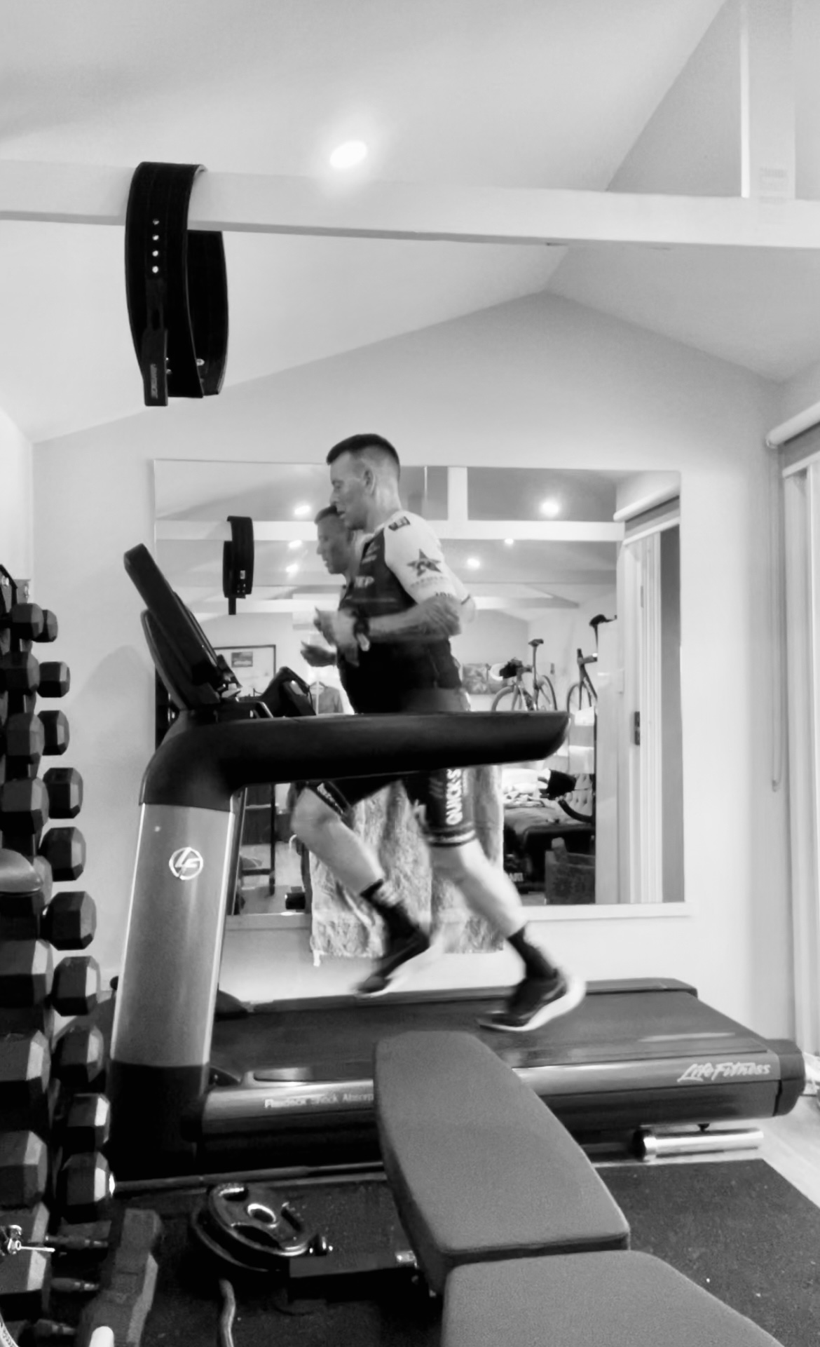 Phillipe running on the treadmill in the home gym