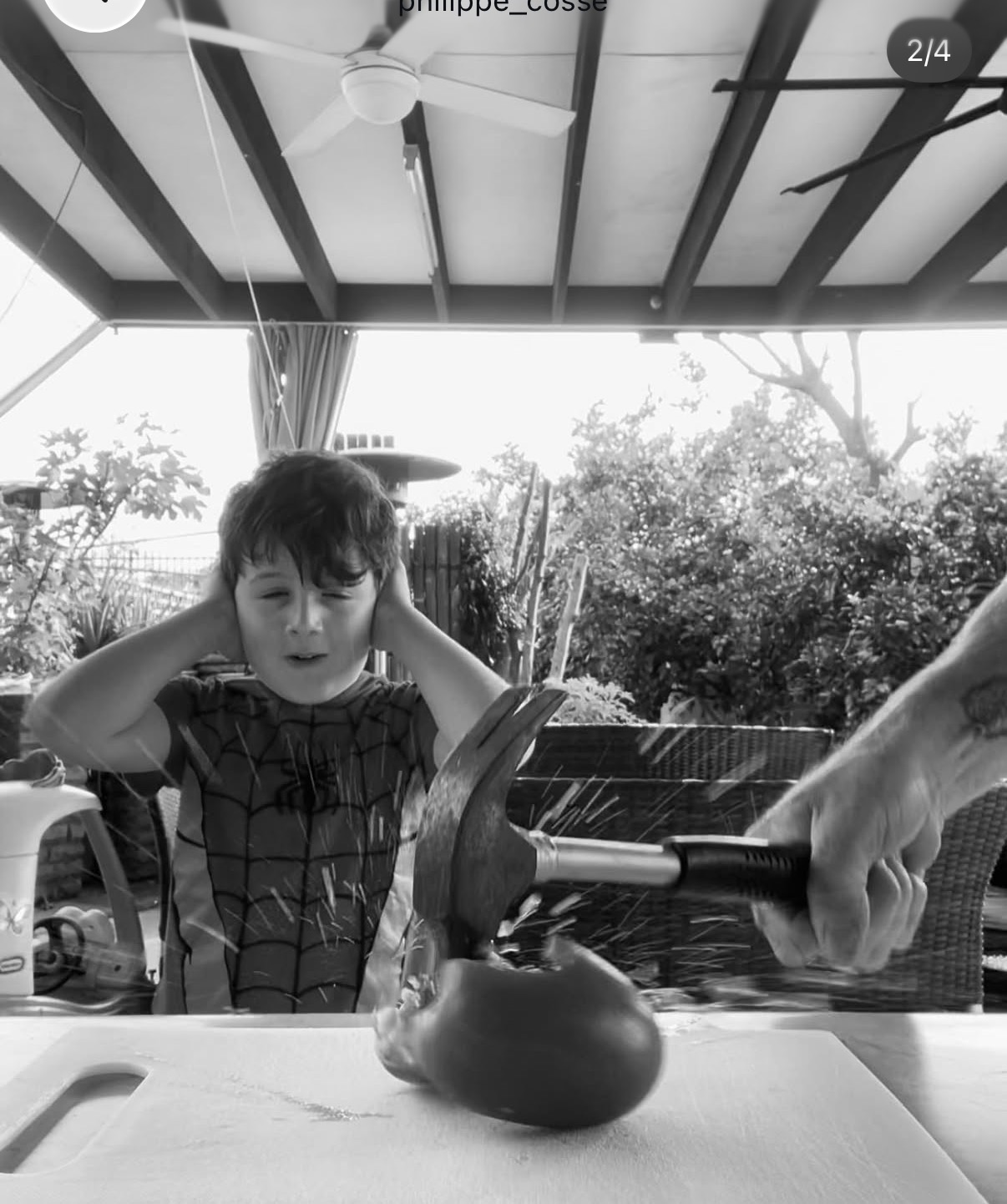 Phillipe recreating the surgeon's hammer-and-tomato analogy with his son watching